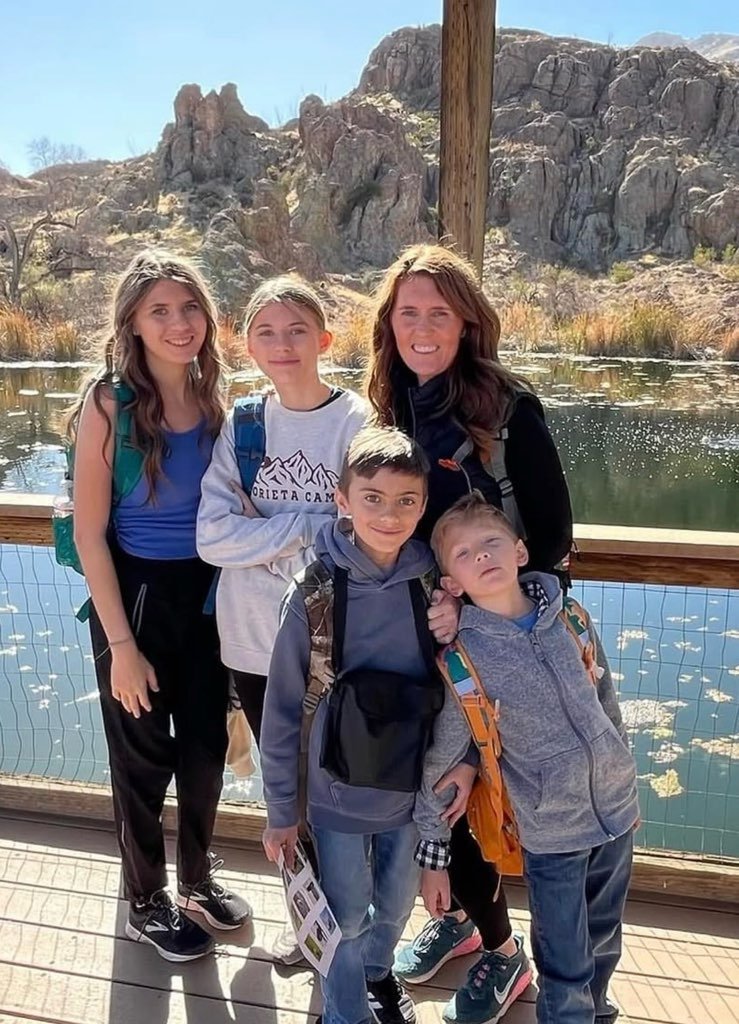 Lori Pappin and her children enjoying an afternoon by a mountain lake