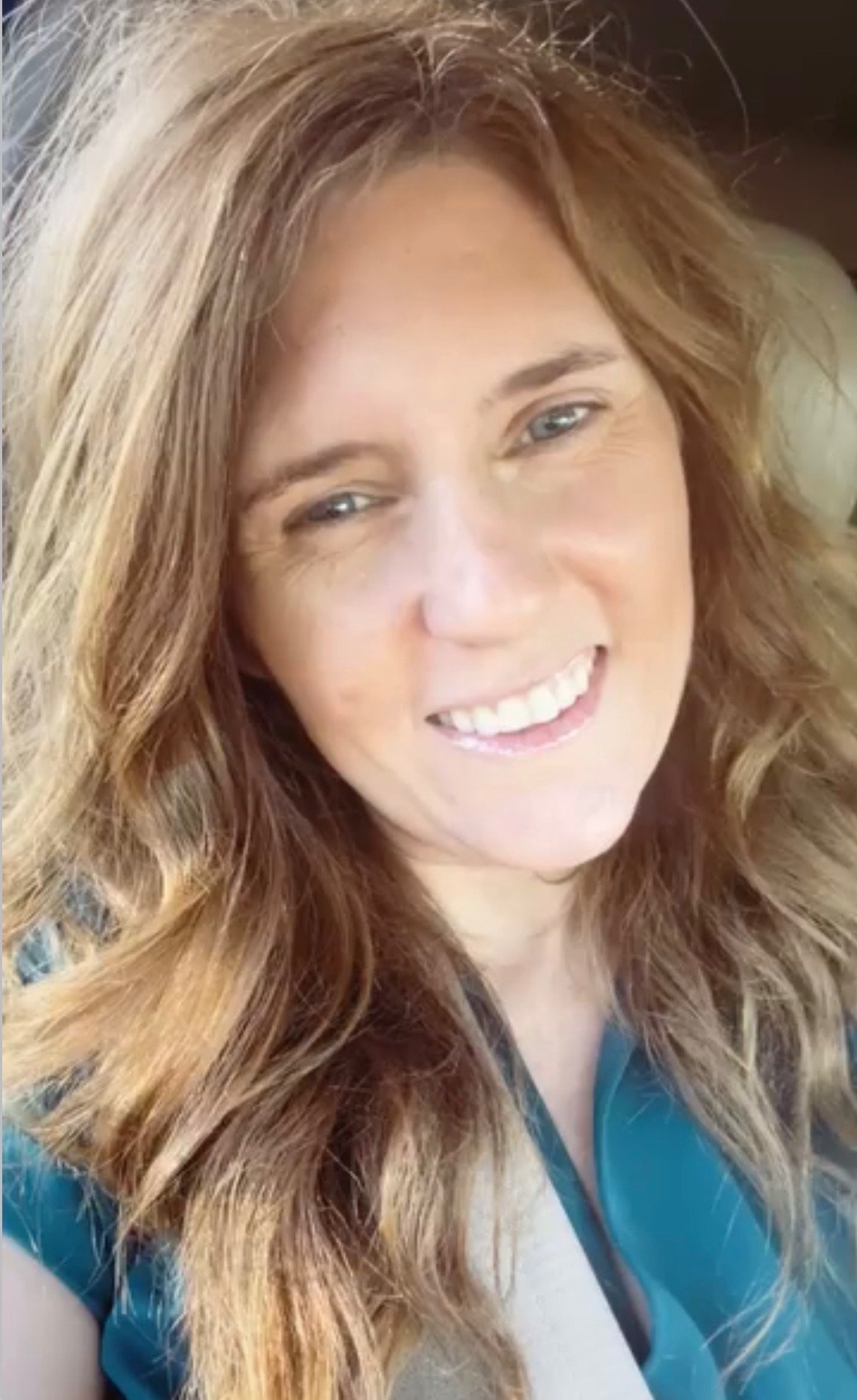 Author Lori Pappin smiling warmly outdoors